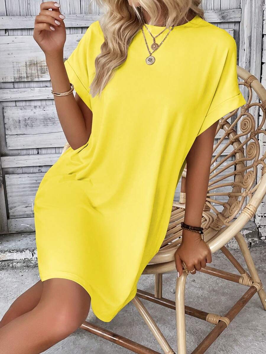 Vestido Curto Camiseta com Bolsos e Manga Morcego - La Lecce