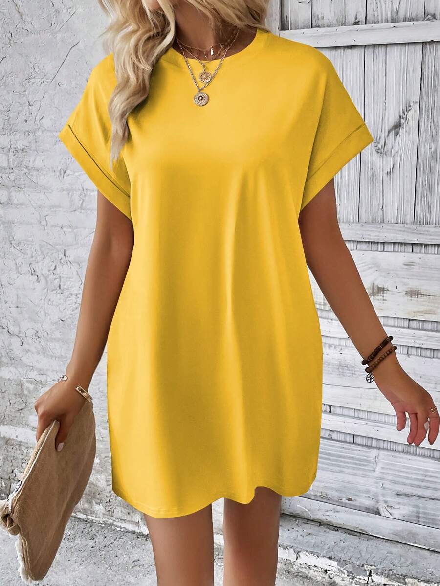 Vestido Curto Camiseta com Bolsos e Manga Morcego - La Lecce