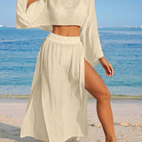 Conjunto de Praia 2 Peças com Cropped de Manga Longa e Saia com Fenda