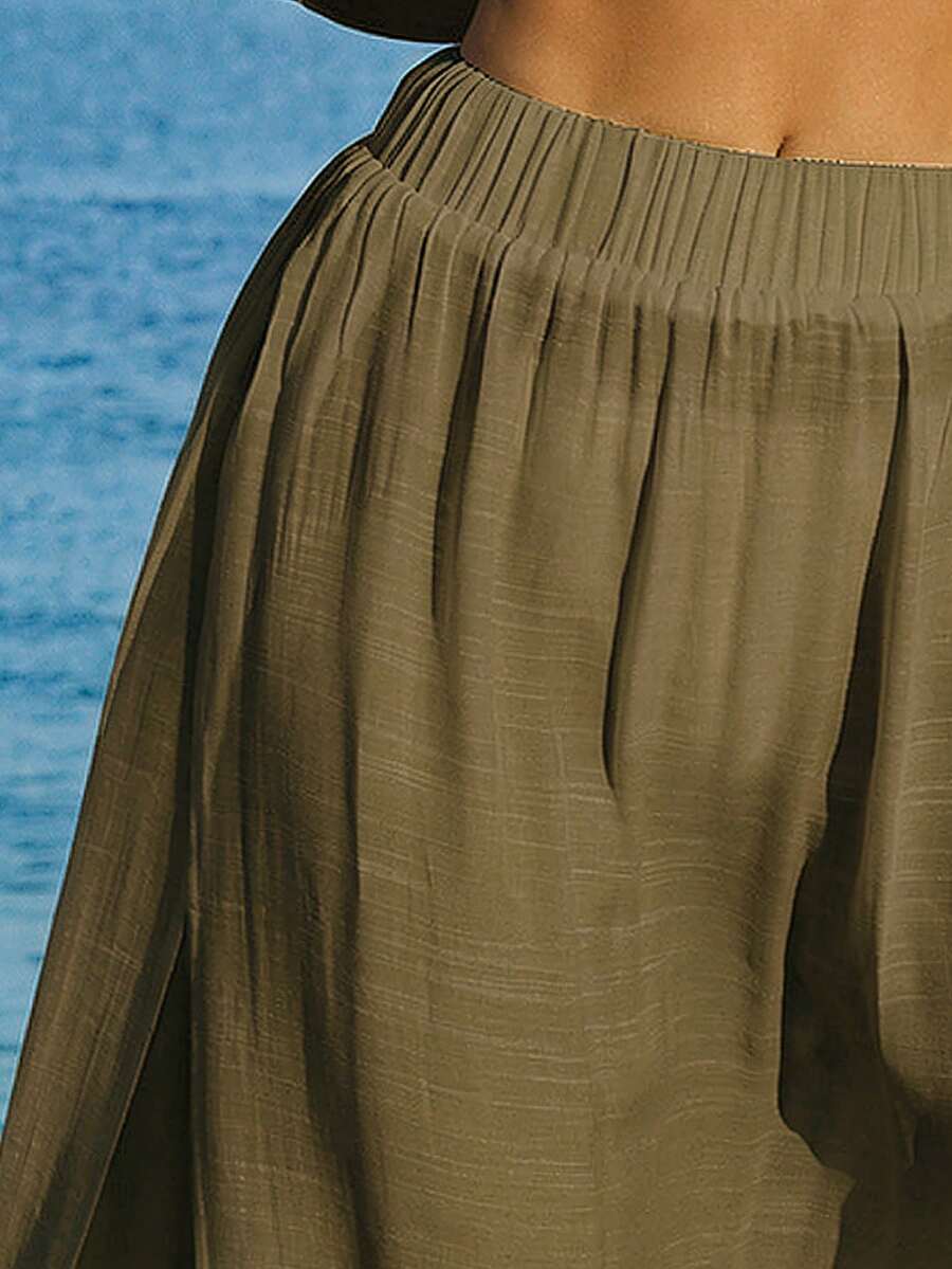 Conjunto de Praia 2 Peças com Cropped de Manga Longa e Saia com Fenda
